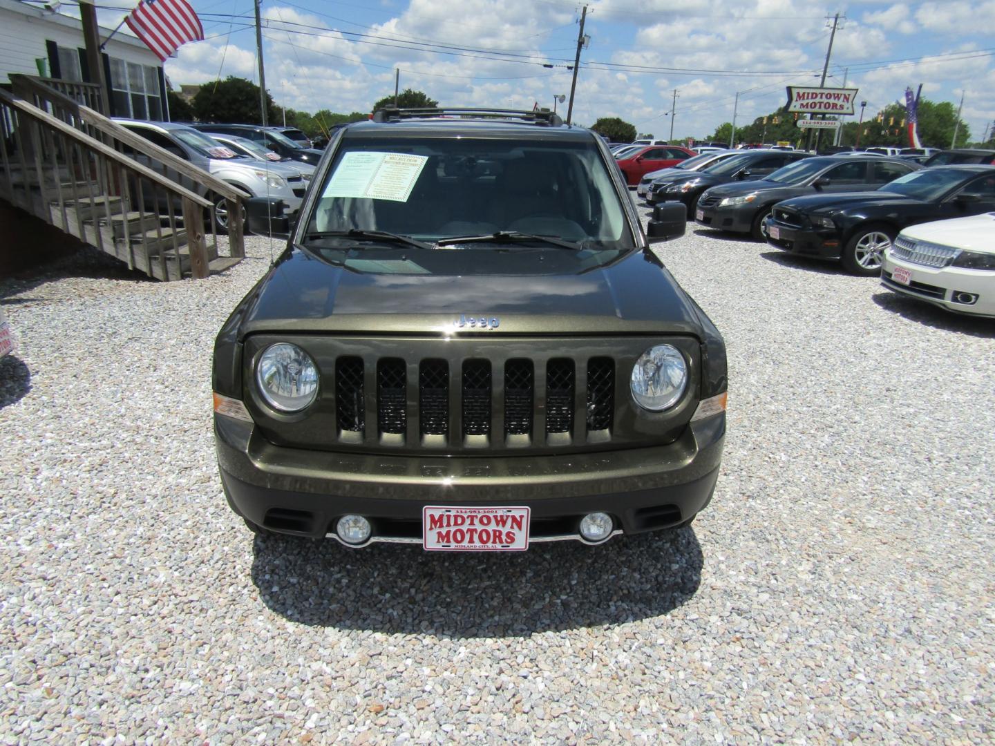 2015 Green /Tan Jeep Patriot (1C4NJPCB2FD) with an 4 CYL engine, Automatic transmission, located at 15016 S Hwy 231, Midland City, AL, 36350, (334) 983-3001, 31.306210, -85.495277 - Photo#1